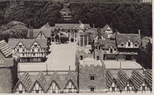 Load image into Gallery viewer, Model of a village with tudor-style houses and a central square.
