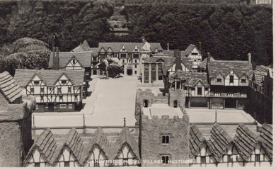 Model of a village with tudor-style houses and a central square.