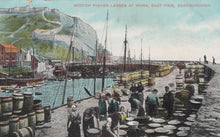 Load image into Gallery viewer, Vintage postcard of Scottish fishermen at work on East Pier, Scarborough
