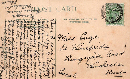 Vintage postcard with handwritten text and a stamp, featuring airmail label.