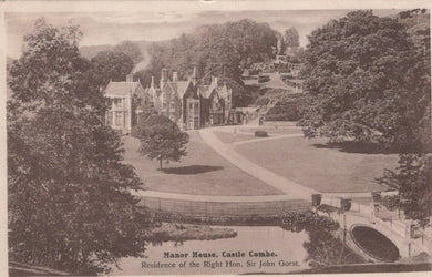 Manor house with a garden and trees in the background