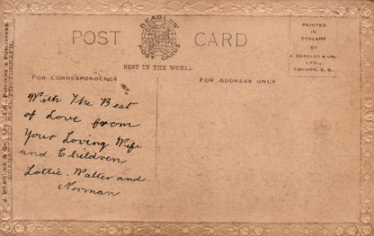 Vintage postcard with decorative border and handwritten message
