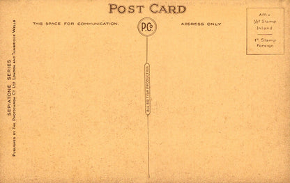 Vintage postcard with airmail stamp and text on a brown background