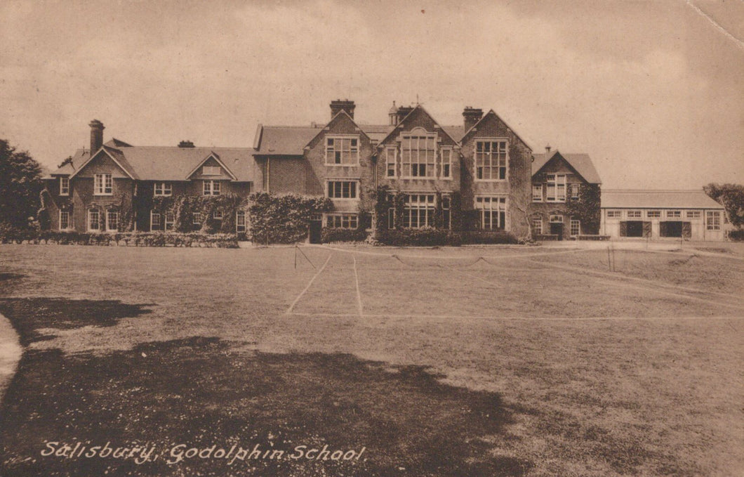 Vintage photograph of a large building with 'Salisbury Godolphin School' text on a grassy field.