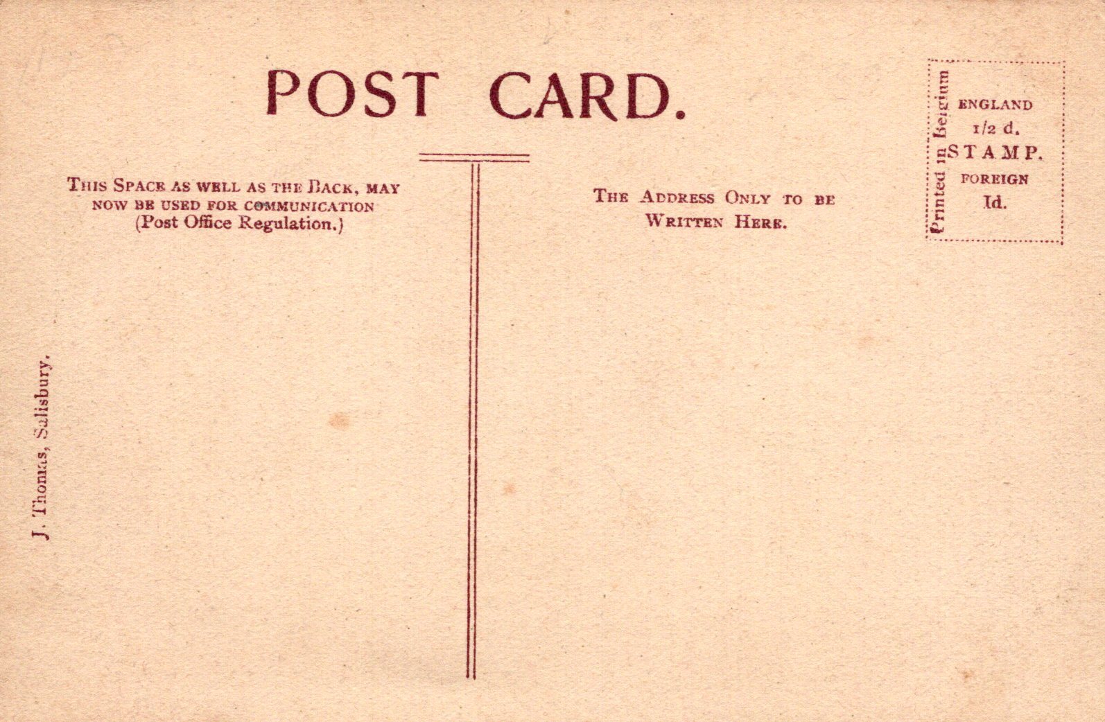 Back of a vintage postcard with text and stamps