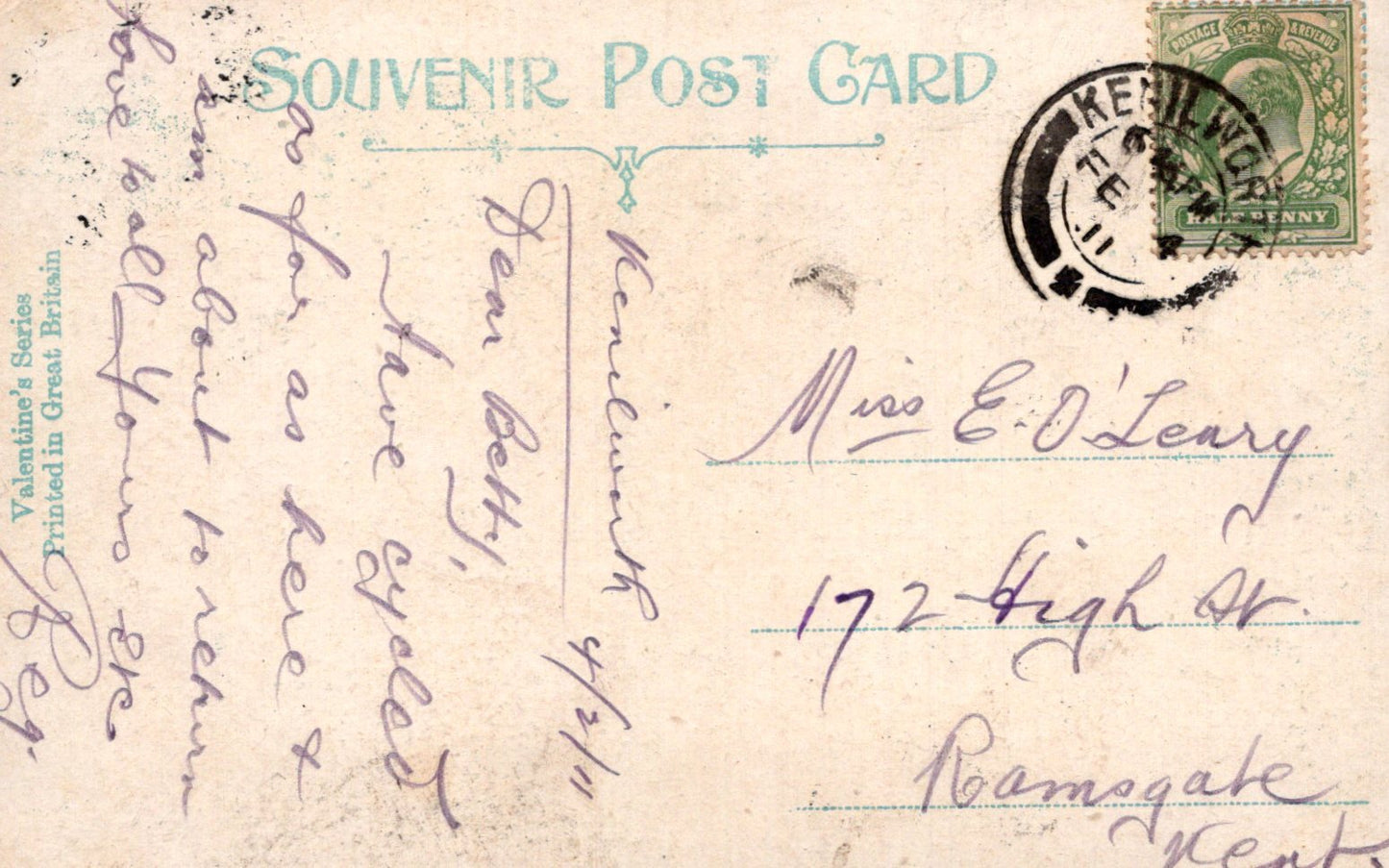 Vintage postcard with text and a stamp on a light brown background