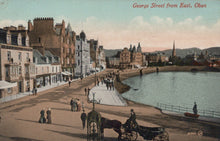 Load image into Gallery viewer, Vintage postcard of George Street from East, Oban, showing a waterfront scene with people and a horse-drawn carriage.
