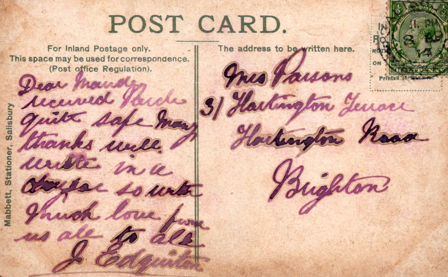 Vintage postcard with handwritten text and a stamp, featuring a brown background.