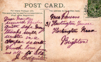 Vintage postcard with handwritten text and a stamp, featuring a brown background.