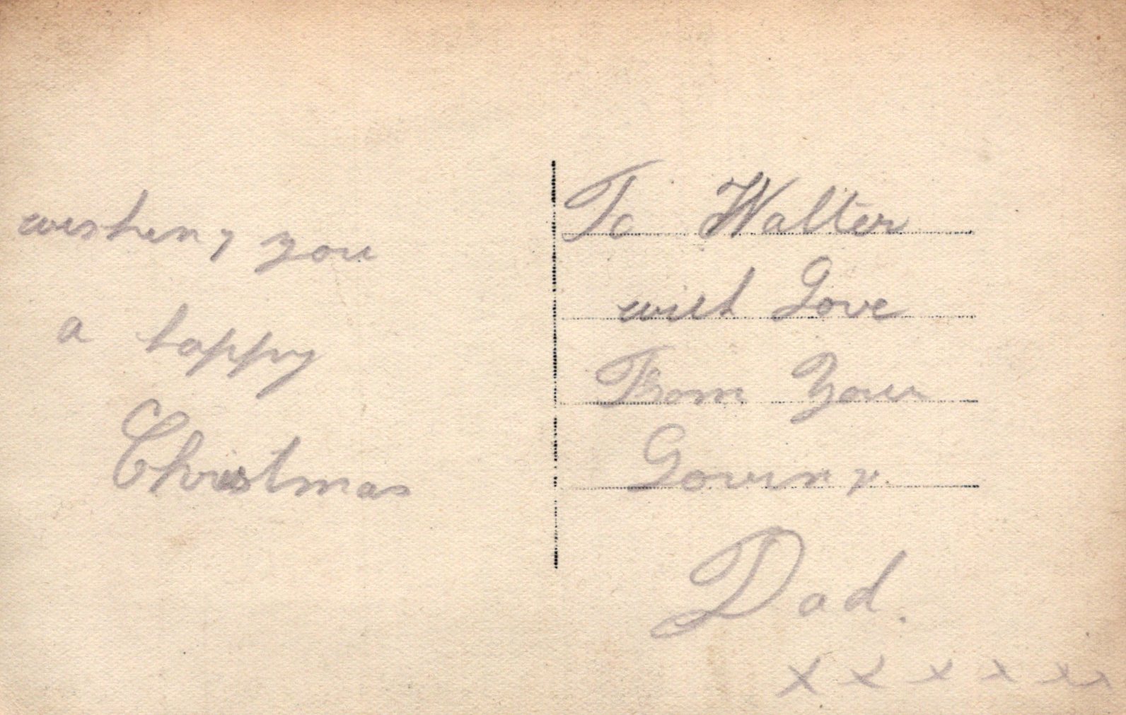 Handwritten Christmas message on a vintage card with decorative elements.