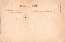 Load image into Gallery viewer, Back of a vintage postcard with text and small holes.
