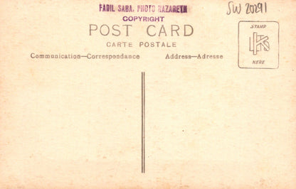 Vintage postcard with text and a stamp on a beige background