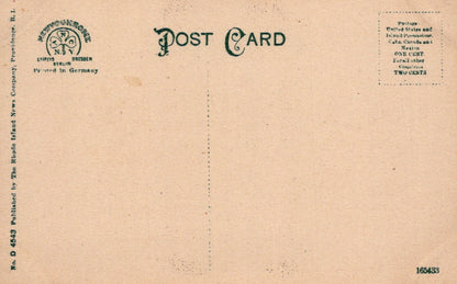 Back of a vintage postcard with text and a logo on a beige background
