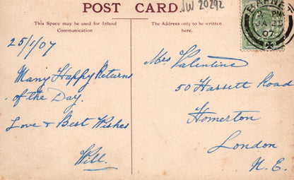 Vintage postcard with handwritten text and a stamp, featuring airmail label.