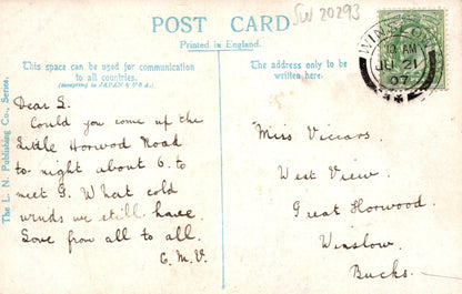 Vintage postcard with handwritten text and a stamp, printed in England.