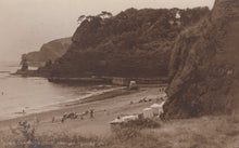 Load image into Gallery viewer, Vintage photograph of a coastal scene with cliffs, beach, and people.
