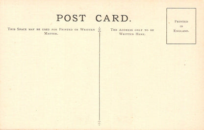 Vintage postcard with printed text and a stamp on a beige background