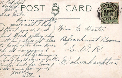 Vintage postcard with handwritten text and a stamp, featuring the word 'POSTCARD' at the top.