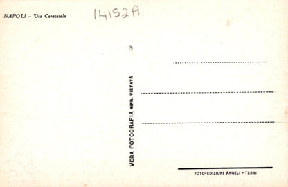 Back of a postcard from Napoli with text and a stamp.