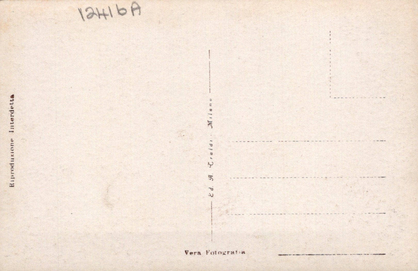 Back of a vintage postcard with printed text and lines for writing.