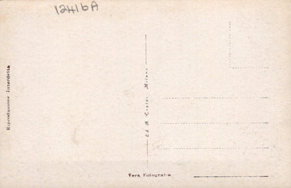 Back of a vintage postcard with printed text and lines for writing.