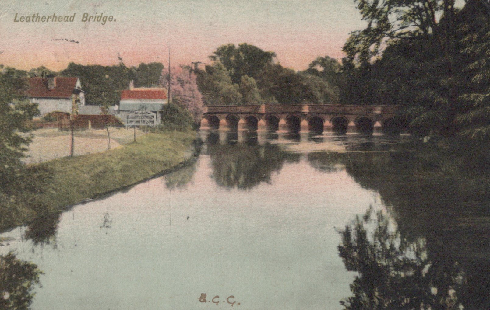 Vintage postcard of Leatherhead Bridge with trees and buildings in the background