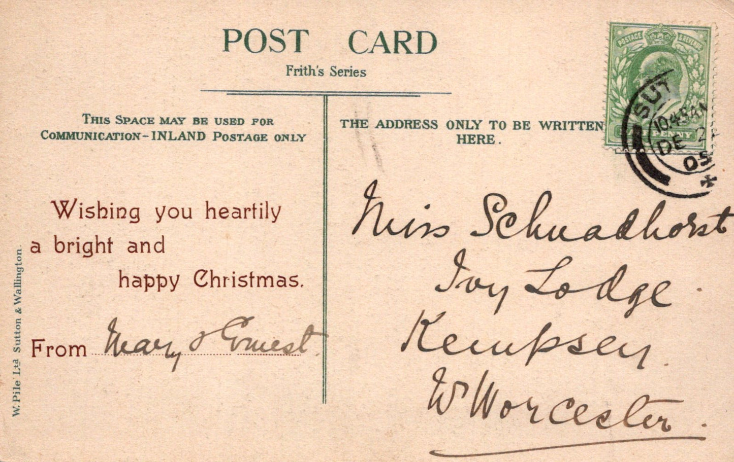 Vintage Christmas postcard with text and postage stamp
