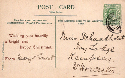 Vintage Christmas postcard with text and postage stamp