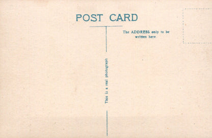 Vintage-style postcard with text and a line for address