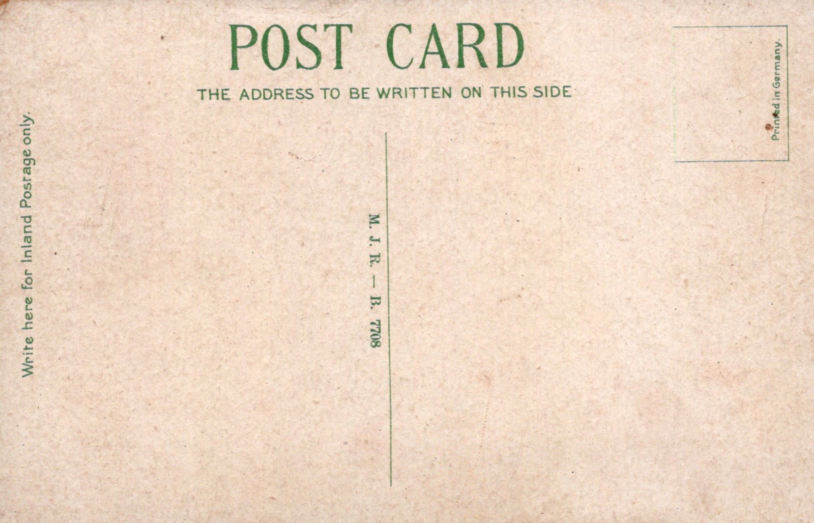 Back of a vintage postcard with text and a grid pattern