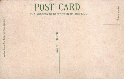 Back of a vintage postcard with text and a grid pattern