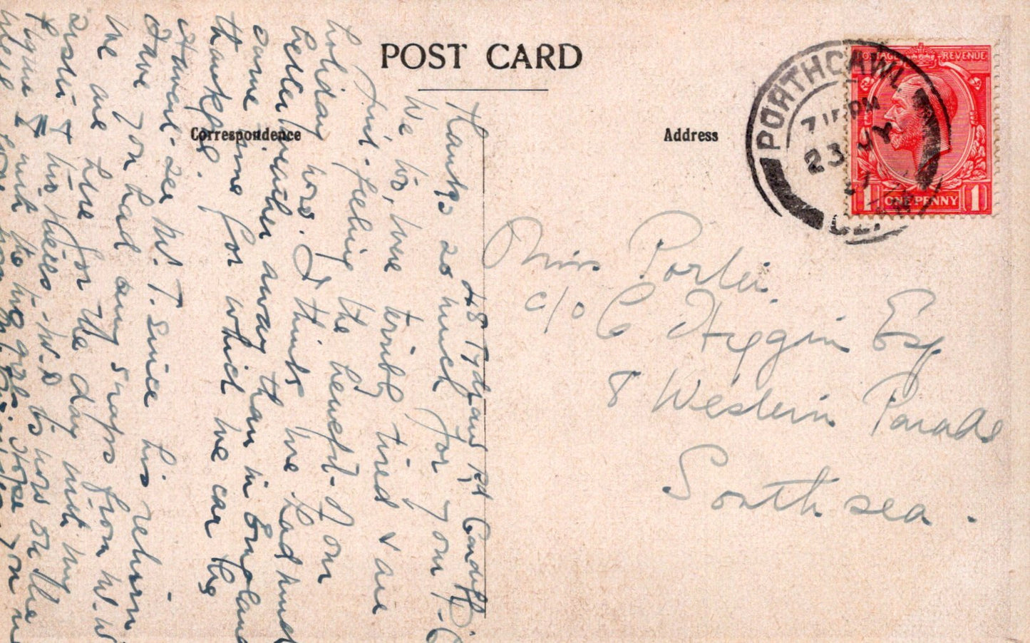 Vintage postcard with handwritten text and a red stamp on a beige background