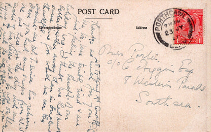 Vintage postcard with handwritten text and a red stamp on a beige background