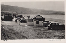 Load image into Gallery viewer, Vintage black and white photo of a beach promenade with huts and cars, featuring &#39;National Caravan&#39; branding.
