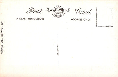 Back of a postcard with 'Marimex' branding and text instructions.