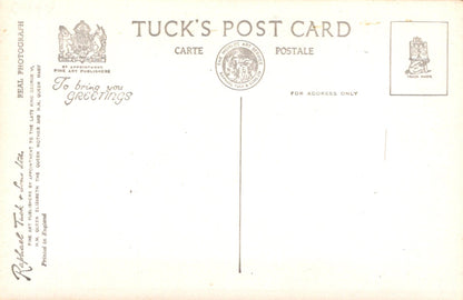 Back of a Tuck's postcard with text and logos
