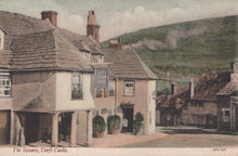 Load image into Gallery viewer, Vintage postcard of a village square with houses and a sign, featuring a steam train in the background.

