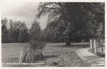 Load image into Gallery viewer, Black and white photo of a park with trees and a path, labeled &#39;The Recreation Ground, Leatherhead&#39;.
