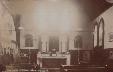 Interior of a church with altar and pews, vintage photograph.