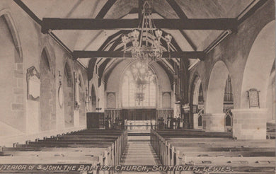 Interior of St. John the Baptist Church, Southwold, England, with pews and a chandelier.