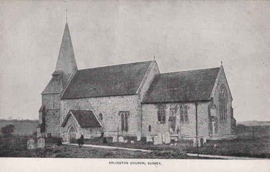 Vintage black and white photograph of a church with a steeple in a rural setting.