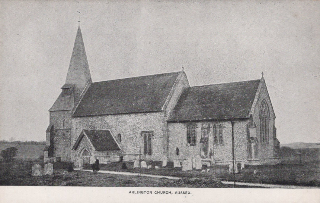 Vintage black and white photograph of a church with a steeple in a rural setting.