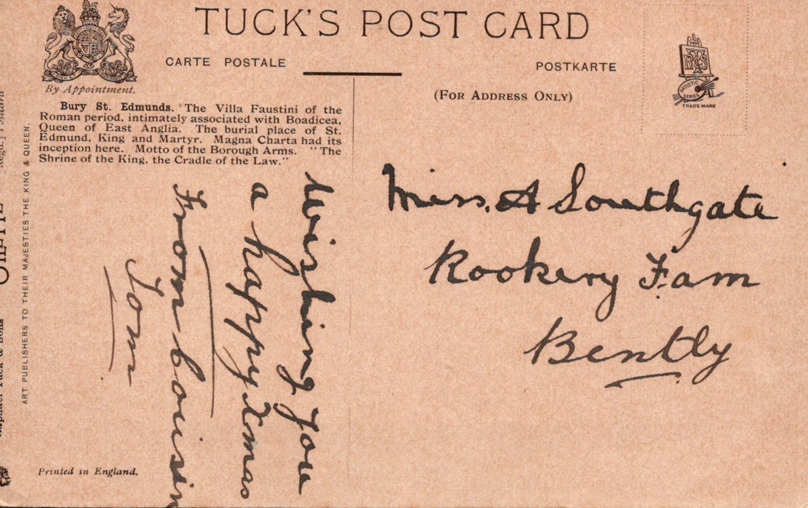 Vintage postcard with text and stamps on a brown background