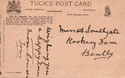 Vintage postcard with text and stamps on a brown background