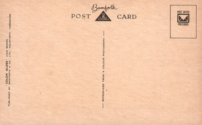 Back of a postcard with 'Bamforth' branding and text