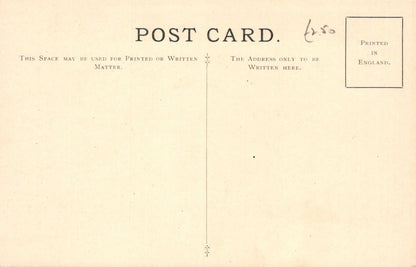 Vintage postcard with printed text and a stamp on a beige background