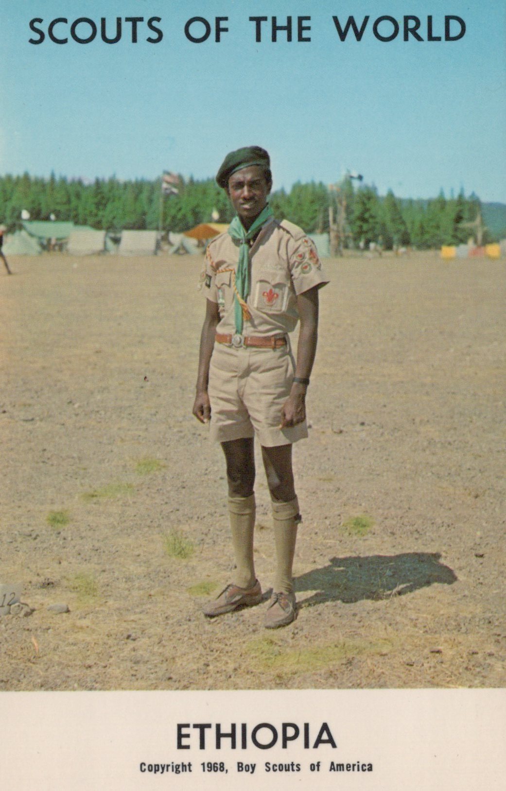 Scout in uniform standing in a field with 'Scouts of the World' and 'Ethiopia' text at the top.
