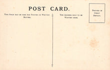 Load image into Gallery viewer, Vintage postcard with printed text and a vertical line for writing on it.
