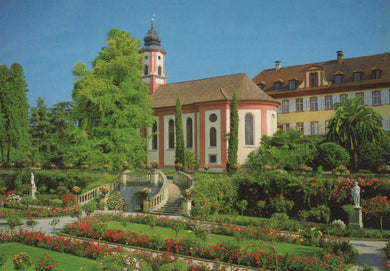 Church with garden and statues in a scenic setting