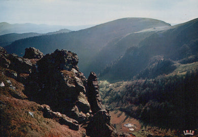 Rugged mountain landscape with rocky outcrops and valleys